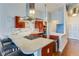 Modern kitchen featuring a large island, cherry cabinets, and stainless steel appliances at 3820 Roswell Ne Rd # 902, Atlanta, GA 30342