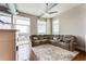 Expansive living room with a large sectional sofa and balcony access at 3820 Roswell Ne Rd # 902, Atlanta, GA 30342