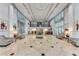 Grand lobby with soaring ceilings, elegant furnishings, and abundant natural light at 3820 Roswell Ne Rd # 902, Atlanta, GA 30342