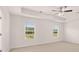 Spacious bedroom with ceiling fan and bright light from the windows at 636 Kimberwick Dr, Locust Grove, GA 30248