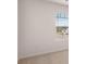 Bright bedroom featuring a window with blinds overlooking the community at 636 Kimberwick Dr, Locust Grove, GA 30248