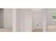 Bedroom showing a view of the closet with wire rack shelving at 636 Kimberwick Dr, Locust Grove, GA 30248