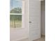 Bedroom with a window with blinds and a six panel door at 636 Kimberwick Dr, Locust Grove, GA 30248