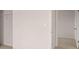 Neutral bedroom view with white doors, trim and a small closet at 636 Kimberwick Dr, Locust Grove, GA 30248