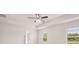 Bright bedroom with neutral walls, ceiling fan and trey ceiling at 636 Kimberwick Dr, Locust Grove, GA 30248