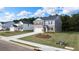 Charming two-story home with a well-maintained lawn and grey and brick exterior at 636 Kimberwick Dr, Locust Grove, GA 30248