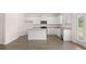 Open-concept kitchen with large island, stainless steel appliances, and abundant cabinet space at 636 Kimberwick Dr, Locust Grove, GA 30248