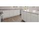 Modern kitchen with white cabinets, granite countertops and stainless steel appliances at 636 Kimberwick Dr, Locust Grove, GA 30248
