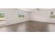 Bright living space featuring large windows and an exterior door at 636 Kimberwick Dr, Locust Grove, GA 30248