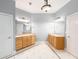 Bathroom featuring tile flooring, a large mirror, wooden vanities, and ample lighting at 3036 Lassiter Rd, Marietta, GA 30062