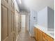 Bathroom with light wood cabinets, white countertops and a glass enclosed shower at 3036 Lassiter Rd, Marietta, GA 30062