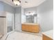 Elegant bathroom boasting tile flooring, a large mirror, and a wooden vanity at 3036 Lassiter Rd, Marietta, GA 30062