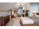 Open concept bedroom and living area with wood beam accents and vaulted ceilings at 3036 Lassiter Rd, Marietta, GA 30062