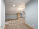 Upstairs bonus room with wood beam accents, carpeted floors and soft blue walls at 3036 Lassiter Rd, Marietta, GA 30062