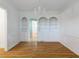 Formal dining area with custom built-ins, hardwood floors and a chandelier at 3036 Lassiter Rd, Marietta, GA 30062