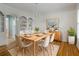 Elegant dining room with hardwood floors, built-in shelving, chandelier and plenty of natural light at 3036 Lassiter Rd, Marietta, GA 30062