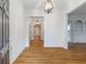 Welcoming foyer boasting hardwood floors and an elegant light fixture at 3036 Lassiter Rd, Marietta, GA 30062