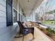 Inviting front porch with rocking chair at 3036 Lassiter Rd, Marietta, GA 30062