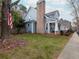 Charming home featuring a brick chimney and lush front yard at 3036 Lassiter Rd, Marietta, GA 30062