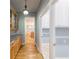 Hallway view leading to kitchen, featuring hardwood floors, and granite countertops at 3036 Lassiter Rd, Marietta, GA 30062