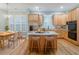 Bright kitchen featuring an island, stainless appliances, and an adjacent dining area at 3036 Lassiter Rd, Marietta, GA 30062
