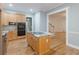 Well-designed kitchen featuring an island cooktop, stainless steel appliances, and hardwood floors at 3036 Lassiter Rd, Marietta, GA 30062