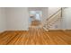 Open floor plan with hardwood floors leading to staircase and spacious kitchen at 3036 Lassiter Rd, Marietta, GA 30062