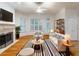 Inviting living room featuring hardwood floors, a fireplace, and plantation shutters at 3036 Lassiter Rd, Marietta, GA 30062