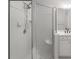 Shower with glass doors and white tile, showcasing a clean and modern design at 3036 Lassiter Rd, Marietta, GA 30062