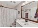 Bathroom features white vanity with a framed mirror and patterned shower curtain at 1712 Green Farm Cir, Dacula, GA 30019