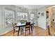Sunlit breakfast nook with hardwood floors and a view of the outdoor deck at 1712 Green Farm Cir, Dacula, GA 30019