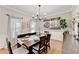 Formal dining area featuring hardwood floors, a chandelier, and ample natural light at 1712 Green Farm Cir, Dacula, GA 30019