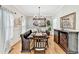 Elegant dining room with hardwood floors, wainscoting, and stylish furniture at 1712 Green Farm Cir, Dacula, GA 30019