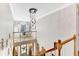 Open foyer featuring modern chandelier, view of office, and stairs at 1712 Green Farm Cir, Dacula, GA 30019