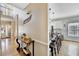 Hallway view leading to a kitchen with barstool seating and a hardwood floor at 1712 Green Farm Cir, Dacula, GA 30019