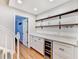 Hallway features custom cabinets, marble countertop and a wine cooler at 1712 Green Farm Cir, Dacula, GA 30019