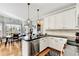 Well-appointed kitchen with white cabinetry, granite countertops, and stainless steel appliances at 1712 Green Farm Cir, Dacula, GA 30019