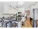 Updated kitchen with stainless steel appliances, granite countertops, and a breakfast bar at 1712 Green Farm Cir, Dacula, GA 30019