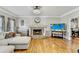Inviting living room with a brick fireplace and hardwood flooring at 1712 Green Farm Cir, Dacula, GA 30019
