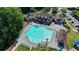 Community pool with ample lounge seating, lifeguard stand, and well-maintained landscaping for relaxation and enjoyment at 1712 Green Farm Cir, Dacula, GA 30019