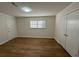 Clean bedroom with laminate floors, and closet, featuring a window that provides plenty of natural light at 239 Andrea Nw Cir, Lilburn, GA 30047