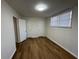 Bright bedroom with laminate floors and natural light, featuring multiple closets for ample storage space at 239 Andrea Nw Cir, Lilburn, GA 30047