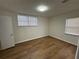 Inviting bedroom with laminate floors and natural light, providing a serene atmosphere for relaxation at 239 Andrea Nw Cir, Lilburn, GA 30047