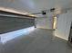 This garage features a sealed concrete floor and brick-lined walls at 239 Andrea Nw Cir, Lilburn, GA 30047