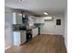 This kitchen features white cabinets, granite countertops, stainless appliances, and lots of light at 239 Andrea Nw Cir, Lilburn, GA 30047