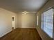 This living room features sleek flooring and lots of natural light at 239 Andrea Nw Cir, Lilburn, GA 30047