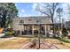 Spacious backyard with patio featuring pergola, outdoor seating, and manicured landscaping at 290 Leigh Kay Dr, Lawrenceville, GA 30046