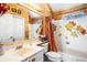 Cozy bathroom features a tub/shower combo with unique leaf-style accents at 290 Leigh Kay Dr, Lawrenceville, GA 30046