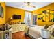 Bright bedroom features hardwood floors, a ceiling fan, TV and walk-in closet at 290 Leigh Kay Dr, Lawrenceville, GA 30046