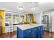 Updated kitchen featuring stainless steel appliances, center island with seating, and bright natural light at 290 Leigh Kay Dr, Lawrenceville, GA 30046